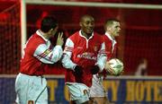 28 December 2001; Charles Mbabazi Livingstone of St Patrick's Athletic celebrates with Martin Russell, left, and Robbie McGuinness, right, after scoring his side's first goal during the eircom League Premier Division match between St Patrick's Athletic and Longford Town at Richmond Park in Dublin. Photo by Pat Murphy/Sportsfile