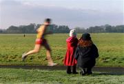 1 January 2002; A mother and daughter watch the competitors in action during the Oman Cup in the Phoenix Park in Dublon. Photo by Brendan Moran/Sportsfile