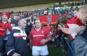 5 January 2002; Peter Clohessy of Munster leads the team out onto the pitch for his 100th game prior to the Heineken Cup Pool 4 Round 5 match between Munster and Harlequins at Thomond Park in Limerick. Photo by Matt Browne/Sportsfile