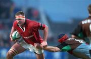 5 January 2002; Mick O'Driscoll of Munster is tackled by Bill Davison of Harlequins during the Heineken Cup Pool 4 Round 5 match between Munster and Harlequins at Thomond Park in Limerick. Photo by Matt Browne/Sportsfile
