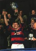 29 December 2001; Clontarf captain Donal Sheehan lifts the cup following the Leinster Senior Cup Final match between Clontarf and County Carlow at Donnybrook Stadium in Dublin. Photo by Matt Browne/Sportsfile