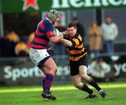 29 December 2001; Alan Dignam of Clontarf is tackled by Mark Buckley of County Carlow during the Leinster Senior Cup Final match between Clontarf and County Carlow at Donnybrook Stadium in Dublin. Photo by Matt Browne/Sportsfile