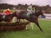 27 December 2001; Eartotheground, with Garrett Cotter up, jumps the last during the paddypower.com Handicap Hurdle on Day Two of the Leopardstown Christmas Festival at Leopardstown Racecourse in Dublin. Photo by Brian Lawless/Sportsfile