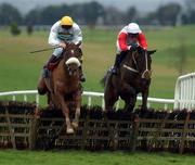 12 January 2002; Eskimo Jack, with Conor O'Dwyer up, left, jump the last ahead of The Young Bishop, with Kieran Kelly up, on their to winning The Mullacurry Maiden Hurdle at Navan Racecourse in Meath. Photo by Damien Eagers/Sportsfile