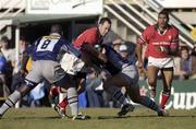 12 January 2002; Mike Mullins of Munster is tackled by Ismaela Lassisi, left, and Arnaud Costes of Castres during the Heineken Cup Pool 4 Round 6 match between Castres and Munster at Stade Pierre-Antoine in Castres, France. Photo by Brendan Moran/Sportsfile