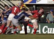 12 January 2002; Anthony Horgan of Munster is tackled by Nicolas Spanghero of Castres during the Heineken Cup Pool 4 Round 6 match between Castres and Munster at Stade Pierre-Antoine in Castres, France. Photo by Brendan Moran/Sportsfile