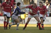 12 January 2002; Peter Clohessy of Munster holds off the challenge of Alexandre Albouy of Castres during the Heineken Cup Pool 4 Round 6 match between Castres and Munster at Stade Pierre-Antoine in Castres, France. Photo by Brendan Moran/Sportsfile