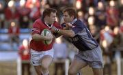 12 January 2002; John Kelly of Munster is tackled by Shaun Longstaff of Castres during the Heineken Cup Pool 4 Round 6 match between Castres and Munster at Stade Pierre-Antoine in Castres, France. Photo by Brendan Moran/Sportsfile