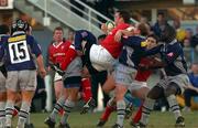12 January 2002; Rob Henderson of Munster is tackled by Guillaume Delmotte, right, Gregor Townsend and Ismaele Lassissi of Castres during the Heineken Cup Pool 4 Round 6 match between Castres and Munster at Stade Pierre-Antoine in Castres, France. Photo by Matt Browne/Sportsfile