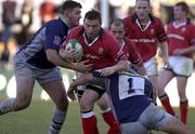 12 January 2002; Rob Henderson of Munster is tackled by Nicolas Spanghero, left, and Mauricio Reggiardo of Castres during the Heineken Cup Pool 4 Round 6 match between Castres and Munster at Stade Pierre-Antoine in Castres, France. Photo by Brendan Moran/Sportsfile