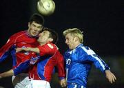 12 January 2002; Davy Byrne, left, and Jim Crawford of   Shelbourne in action against Neil Fitzhenry of Finn Harps during the FAI Carlsberg Cup Third Round match between Finn Harps and Shelbourne at Finn Park in Ballybofey, Donegal. Photo by David Maher/Sportsfile