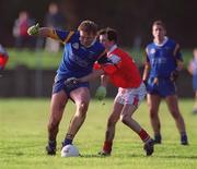 13 January 2001; Fergus Daly of Wicklow in action against Simon Gerard of Louth during the O'Byrne Cup Semi-Final match between Louth and Wicklow at O'Raghallaighs GAA Club in Drogheda, Louth. Photo by Ray McManus/Sportsfile