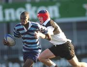 15 January 2002; Paul Olima of Castleknock College is tackled by Mark Neylon of Newbridge College during the Schools Rugby Junior League Final match between Castleknock College and Newbridge College at Donnybrook Stadium in Dublin. Photo by Aoife Rice/Sportsfile