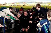 15 January 2002; Mick Galwey makes his way through the hundreds of schoolkids during a Ireland Rugby squad training session and press conference at Thomond Park in Limerick. Photo by Matt Browne/Sportsfile