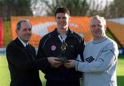 17 January 2002; Pictured at the presentation of the eircom/Soccer Writers Association of Ireland award for the player of the month for December is, from left, eircom Head of Corporate marketing Padraig Corkery, winner of the award Kevin Doherty of Shelbourne and manager Dermot Keely at Tolka Park in Dublin. Photo by Ray McManus/Sportsfile