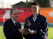 17 January 2002; Pictured at the presentation of the eircom/Soccer Writers Association of Ireland award for the player of the month for December is eircom Head of Corporate marketing Padraig Corkery and winner of the award Kevin Doherty of Shelbourne at Tolka Park in Dublin. Photo by Ray McManus/Sportsfile