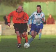 13 January 2002; Kevin Ennis of St Kevin's Boys in action against Gary Beckett of Derry City during the FAI Carlsberg Cup Third Round match between St Kevin's Boys and Derry City in Whitehall, Dublin. Photo by Ray Lohan/Sportsfile
