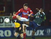 18 January 2002; Jim Crawford of Shelbourne in action against Mbabazi Livingstone of St Patrick's Athletic during the eircom League Premier Division match between Shelbourne and St Patrick's Athletic at Tolka Park in Dublin. Photo by David Maher/Sportsfile
