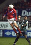 18 January 2002; Jim Crawford of Shelbourne in action against Mbabazi Livingstone of St Patrick's Athletic during the eircom League Premier Division match between Shelbourne and St Patrick's Athletic at Tolka Park in Dublin. Photo by Damien Eagers/Sportsfile