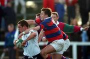 19 January 2002; Ronan O'Donovan of Cork Constitution goes over for his try despite the tackle of Alan Reddan of Clontarf during the AIB All-Ireland League Division 1 match between Cork Constitution and Clontarf at Temple Hill in Cork. Photo by Matt Browne/Sportsfile