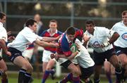 19 January 2002; James Downey of Clontarf is tackled by Jerry Murray, Conor Mahony, and Jim Williams of Cork Constitution during the AIB All-Ireland League Division 1 match between Cork Constitution and Clontarf at Temple Hill in Cork. Photo by Matt Browne/Sportsfile