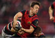 10 December 2016; Darren Sweetnam of Munster is tackled by Adam Thompstone, left, and Tom Youngs of Leicester Tigers during the European Rugby Champions Cup Pool 1 Round 3 match between Munster and Leicester Tigers at Thomond Park in Limerick. Photo by Brendan Moran/Sportsfile