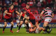 10 December 2016; Peter O’Mahony of Munster beats the tackle of Tom Youngs of Leicester Tigers during the European Rugby Champions Cup Pool 1 Round 3 match between Munster and Leicester Tigers at Thomond Park in Limerick. Photo by Brendan Moran/Sportsfile