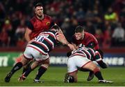 10 December 2016; Jack O'Donoghue of Munster is tackled by Greg Bateman and George McGuigan of Leicester Tigers during the European Rugby Champions Cup Pool 1 Round 3 match between Munster and Leicester Tigers at Thomond Park in Limerick. Photo by Diarmuid Greene/Sportsfile