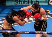 10 December 2016; Katie Taylor, right, exchanges punches with Viviane Obenauf during their Super-Featherweight fight at the Manchester Arena in Manchester, England. Photo by Stephen McCarthy/Sportsfile