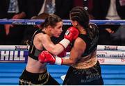 10 December 2016; Katie Taylor, left, exchanges punches with Viviane Obenauf during their Super-Featherweight fight at the Manchester Arena in Manchester, England. Photo by Stephen McCarthy/Sportsfile