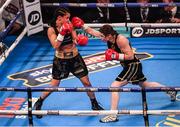 10 December 2016; Katie Taylor, right, exchanges punches with Viviane Obenauf during their Super-Featherweight fight at the Manchester Arena in Manchester, England. Photo by Stephen McCarthy/Sportsfile