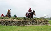 5 May 2011; Let The Show Begin, right, with Ciaran Murphy up, jumps the tenth fence, the Stone Wall, ahead of eventual winer Another Jewel, left, with John Cullen up, during the Avon Ri Corporate & Leisure Resort Steeplechase for the La Touche Cup. Punchestown Irish National Hunt Festival 2011, Punchestown, Co. Kildare. Picture credit: Barry Cregg / SPORTSFILE