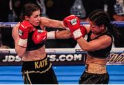 10 December 2016; Katie Taylor, left, exchanges punches with Viviane Obenauf during their Super-Featherweight fight at the Manchester Arena in Manchester, England. Photo by Stephen McCarthy/Sportsfile