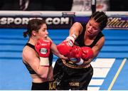 10 December 2016; Viviane Obenauf, right, exchanges punches with Katie Taylor during their Super-Featherweight fight at the Manchester Arena in Manchester, England. Photo by Stephen McCarthy/Sportsfile
