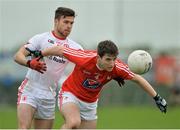 11 December 2016; Kevin Carr of Louth in action against Darren McCurry of Tyrone during the O'Fiaich Cup Semi Final match between Tyrone and Louth at St Oliver Plunkett Park in Crossmaglen, Armagh. Photo by Oliver McVeigh/Sportsfile