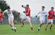 11 December 2016; Gerard McSorley of Louth in action against Jonathan Munroe and Michael Cassidy of Tyrone during the O'Fiaich Cup Semi Final match between Tyrone and Louth at St Oliver Plunkett Park in Crossmaglen, Armagh. Photo by Oliver McVeigh/Sportsfile