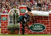 23 July 2016; Eóin McMahon of Ireland, competing on Kings Lux, fails to clear the wall during the The Land Rover Puissance at the Dublin Horse Show in the RDS, Ballsbridge, Dublin. Photo by Sam Barnes/Sportsfile