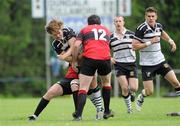 24 April 2011; Mark Roundtree, Dundalk RFC, is tackled by Aaron Deverell, left, and Ivor Scully, Tullamore RFC. Newstalk Provincial Towns Cup Final, Dundalk RFC v Tullamore RFC, Edenderry RFC, Coolavacoose, Carbury, Co. Kildare. Picture credit: Barry Cregg / SPORTSFILE