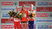 11 December 2016; Anna Emile Møller of Denmark, second place, left, Konstanze Klosterhalfen of Germany, first place, centre, and Harriet Knowles-Jones of Great Britain, third place, right, during the under 20 Women's race medal presentations at the 2016 Spar European Cross Country Championships in Chia, Italy. Photo by Eóin Noonan/Sportsfile