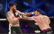 16 December 2016; Richard Kiely, right, in action against Kieth McCabe during their welterweight bout at BAMMA 27 in the 3 Arena in Dublin. Photo by Ramsey Cardy/Sportsfile