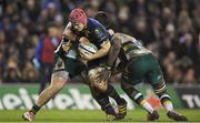 17 December 2016; Josh van der Flier of Leinster is tackled by Tom Collins and Api Ratuniyarawa of Northampton Saints during the European Rugby Champions Cup Pool 4 Round 4 match between Leinster and Northampton Saints at the Aviva Stadium, Dublin. Photo by Brendan Moran/Sportsfile