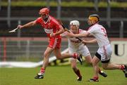 14 May 2011; Mark Craig, Derry, in action against Stephen Donnelly and Damian Maguire, Tyrone. Ulster GAA Hurling Senior Championship, First Round, Tyrone v Derry, Healy Park, Omagh, Co. Tyrone. Picture credit: Oliver McVeigh / SPORTSFILE