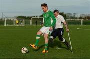 18 December 2016; Damien Duff, FAI selection, in action against Garry Hoey, Irish Amputee Football team, during an exhibition game between the Irish Amputee Football team and an FAI selection, including Damien Duff, Irish Amputee Football Association Ambassador, Robbie Keane and Noel King. FAI National Training Centre in Abbotstown, Co. Dublin. Photo by Piaras Ó Mídheach/Sportsfile