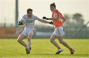 18 December 2016; Niall McKenna of Tyrone in action against Joe McElroy of Armagh during the O'Fiaich Cup Final game between Armagh and Tyrone at Oliver Plunkett Park in Crossmaglen, Co. Armagh. Photo by Oliver McVeigh/Sportsfile