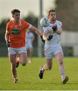 18 December 2016; Niall McKenna of Tyrone in action against Anthony Duffy of Armagh during the O'Fiaich Cup Final game between Armagh and Tyrone at Oliver Plunkett Park in Crossmaglen, Co. Armagh. Photo by Oliver McVeigh/Sportsfile