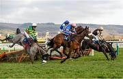 16 March 2016; Diego Du Charmil, with Sam Twiston-Davies up, on their way to winning the Fred Winter Juvenile Handicap Hurdle as Campeador, with Barry Geraghty up, left, and Voix Du Reve, with Ruby Walsh up, right, fall at the last. Also pictured Coo Star Sivola, with Lizzie Kelly up, back centre. Prestbury Park, Cheltenham, Gloucestershire, England. Photo by Cody Glenn/Sportsfile