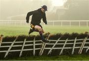 20 November 2016; Jockey Patrick Mullins jumps the final fence during a jog at Punchestown Racecourse in Naas, Co. Kildare. Photo by Ramsey Cardy/Sportsfile