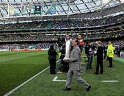 18 May 2011; UEFA Europa League final ambassador for Dublin and former Republic of Ireland International Ronnie Whelan brings out the cup before the start of the game. UEFA Europa League Final, FC Porto v SC Braga, Dublin Arena, Lansdowne Road, Dublin. Picture credit: Brian Lawless / SPORTSFILE