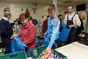21 December 2016; Dublin footballer Con O'Callaghan lends a hand packing some of the 3,000 Christmas parcels for the homeless at the Capuchin Day Centre on Bow Street, Dublin. Photo by Piaras Ó Mídheach/Sportsfile