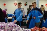 21 December 2016; Dublin footballers Con O'Callaghan, left, and Jonny Cooper as they lend a hand packing some of the 3,000 Christmas parcels for the homeless at the Capuchin Day Centre on Bow Street, Dublin. Photo by Piaras Ó Mídheach/Sportsfile